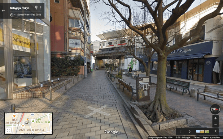 train-passing-over-green-street